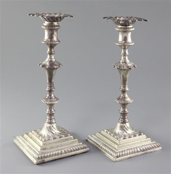 A pair of early George III cast silver candlesticks by Ebenezer Coker, height 26cm.